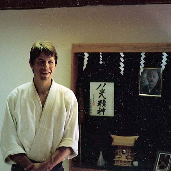 Shihan Brian W. Workman Smiling, Wearing Hakama in Dojo